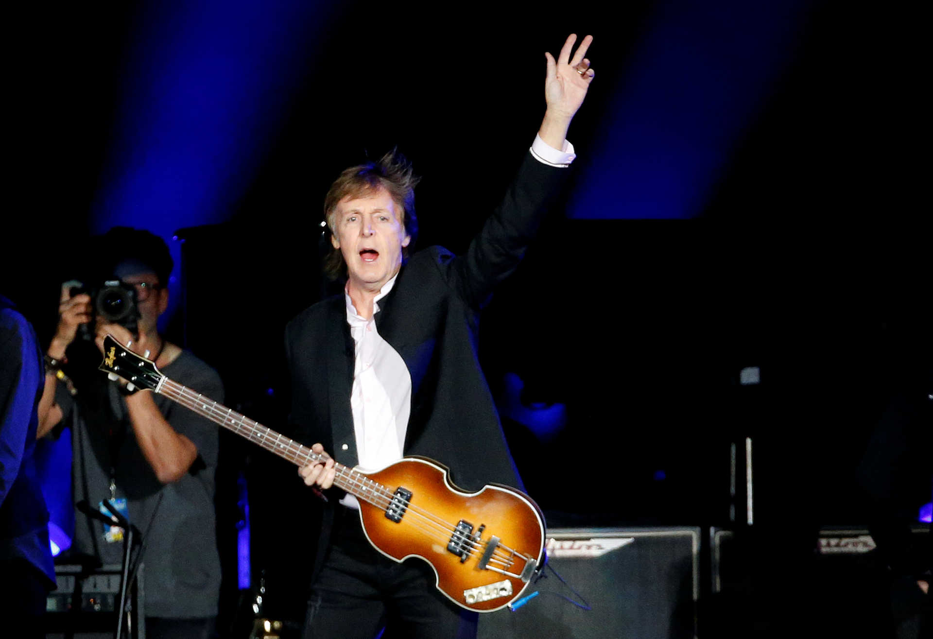 Musician Paul McCartney waves as he takes the stage to perform at the Desert Trip music festival at Empire Polo Club in Indio, California, U.S., October 8, 2016. REUTERS/Mario Anzuoni