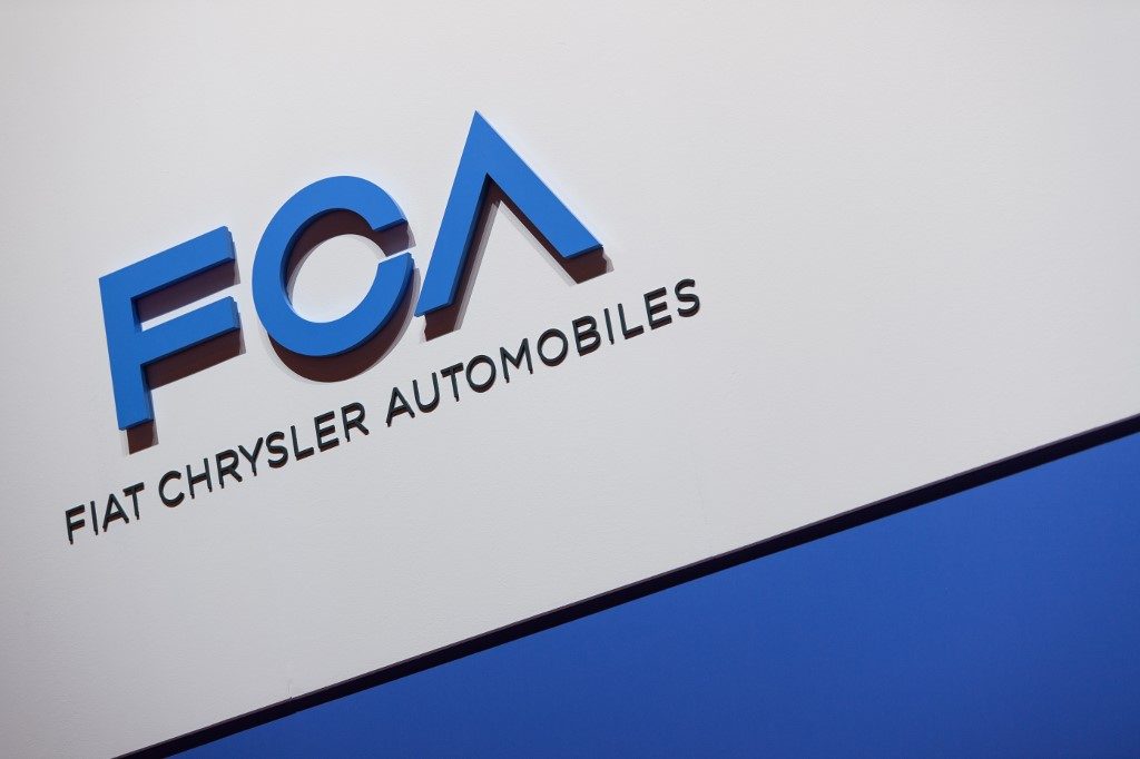 A FCA (Fiat Chrysler Automobiles) logo is displayed on March 6, 2019 during a press day ahead of the Geneva International Motor Show in Geneva. - The 2019 edition of the Geneva International Motor Show will be held from March 7 to March 17, 2019. (Photo by Harold CUNNINGHAM / AFP)